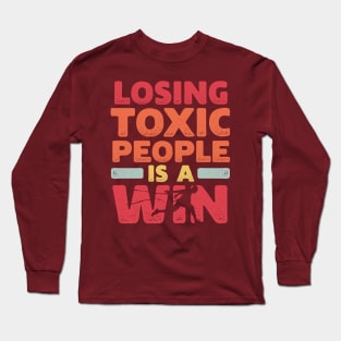 Motivational Winning Style Statement Wisdom Quote LOSING TOXIC PEOPLE IS A WIN Distressed Retro Vintage Modern Textured Typographic design Long Sleeve T-Shirt